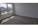 Bright bedroom with plush carpeting and a large window providing natural light and neighborhood views at 11302 N Quillow Way, Monrovia, IN 46157