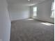 Large bedroom featuring plush carpeting, neutral walls, and ample natural light at 11302 N Quillow Way, Monrovia, IN 46157