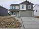 Two-story home with gray-tone accents, white siding, and a two-car garage at 11302 N Quillow Way, Monrovia, IN 46157