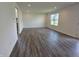 Spacious living area with luxury vinyl plank flooring, neutral walls and recessed lighting at 11302 N Quillow Way, Monrovia, IN 46157