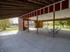 Pavilion interior offering picnic tables on a concrete slab under a wood beam roof at 11302 N Quillow Way, Monrovia, IN 46157