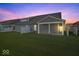 Spacious backyard with lush green grass and a covered patio, perfect for outdoor gatherings and relaxation at 11469 Lottie Cir, Noblesville, IN 46060