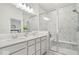 Luxurious bathroom with double vanity and glass-enclosed shower at 11469 Lottie Cir, Noblesville, IN 46060