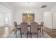 Elegant dining room with modern lighting fixture and neutral tones at 11469 Lottie Cir, Noblesville, IN 46060