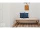 Inviting entryway with bench seating, decorative pillows, and convenient hanging hooks for storage at 11469 Lottie Cir, Noblesville, IN 46060