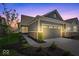 Charming single-story home featuring a two-car garage, landscaped yard, and modern exterior at 11469 Lottie Cir, Noblesville, IN 46060