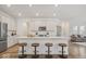 Spacious modern kitchen with white cabinets, quartz countertops, and island with seating at 11469 Lottie Cir, Noblesville, IN 46060
