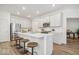 Modern kitchen with quartz countertops, stainless steel appliances, and island seating at 11469 Lottie Cir, Noblesville, IN 46060