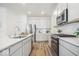 Modern kitchen with stainless steel appliances and quartz countertops at 11469 Lottie Cir, Noblesville, IN 46060