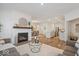 Open-concept living room with fireplace flows to dining area and kitchen at 11469 Lottie Cir, Noblesville, IN 46060