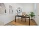 Well-lit home office with desk, clock, and indoor plant at 11469 Lottie Cir, Noblesville, IN 46060