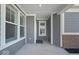 Covered porch features refined architecture, providing a sheltered transition from outside to the interior at 11469 Lottie Cir, Noblesville, IN 46060