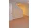 Unfinished basement with light carpet and staircase at 11850 Stepping Stone Dr, Fishers, IN 46037