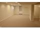 Unfinished basement space with carpeted flooring, window and built in shelving at 11850 Stepping Stone Dr, Fishers, IN 46037