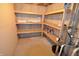 Unfinished basement storage area with wood shelving at 11850 Stepping Stone Dr, Fishers, IN 46037