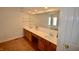 Bright bathroom featuring double vanity, large mirror and tub at 11850 Stepping Stone Dr, Fishers, IN 46037