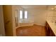 Corner tub with jets is flanked by a shower stall and vanity at 11850 Stepping Stone Dr, Fishers, IN 46037