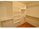 Walk-in closet with built-in shelving and organization system at 11850 Stepping Stone Dr, Fishers, IN 46037
