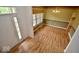 Bright dining room with wood floors, large window, and elegant chandelier at 11850 Stepping Stone Dr, Fishers, IN 46037
