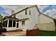 The house is white with a brown roof and chimney, along with a brick wall and stamped concrete patio at 11850 Stepping Stone Dr, Fishers, IN 46037