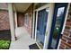 Charming front door and porch of a brick home at 11850 Stepping Stone Dr, Fishers, IN 46037