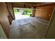 View of the empty concrete floor garage with an open door facing the front yard at 11850 Stepping Stone Dr, Fishers, IN 46037