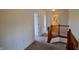Upstairs hallway with railing and multiple doorways at 11850 Stepping Stone Dr, Fishers, IN 46037
