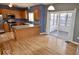 Kitchen featuring wooden cabinets, granite countertops, and access to the sunroom at 11850 Stepping Stone Dr, Fishers, IN 46037