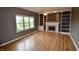 Spacious living room featuring a fireplace and built-in bookshelves at 11850 Stepping Stone Dr, Fishers, IN 46037