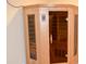 Home sauna with cedar interior and glass door at 11850 Stepping Stone Dr, Fishers, IN 46037