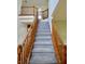 Elegant staircase with wooden railings and plush carpeting at 11850 Stepping Stone Dr, Fishers, IN 46037