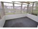 The sunroom has lots of windows and overlooks a pond at 11850 Stepping Stone Dr, Fishers, IN 46037