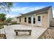 Backyard area showcasing a wooden deck, partial fence, lawn, and gravel area at 12257 Driftstone Dr, Fishers, IN 46037