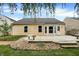 Backyard area featuring a wooden deck with built-in benches and surrounding gravel area at 12257 Driftstone Dr, Fishers, IN 46037