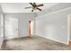 Neutral bedroom with carpet, ceiling fan, closet and bathroom access at 12257 Driftstone Dr, Fishers, IN 46037