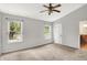 Light, airy bedroom with carpet, and windows with outdoor views at 12257 Driftstone Dr, Fishers, IN 46037
