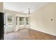 Dining area with tile floors, adjacent to back door and bay window at 12257 Driftstone Dr, Fishers, IN 46037
