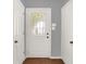 Bright entryway featuring a decorative glass front door, tiled flooring, and closet at 12257 Driftstone Dr, Fishers, IN 46037