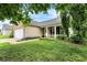 Well-kept home featuring a lush green lawn, colorful landscaping, and charming front porch at 12257 Driftstone Dr, Fishers, IN 46037