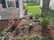 Front yard featuring spring flowers and a tree, offering curb appeal to this home at 12257 Driftstone Dr, Fishers, IN 46037