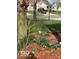 Front yard featuring spring flowers and a tree, offering curb appeal to this home at 12257 Driftstone Dr, Fishers, IN 46037