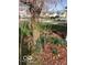 A front yard features a weeping cherry tree surrounded by mulch and spring flowers, adding curb appeal to the property at 12257 Driftstone Dr, Fishers, IN 46037