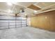 Spacious garage with a new garage door, ample lighting, and pegboard walls, offering plenty of storage and workspace at 12257 Driftstone Dr, Fishers, IN 46037