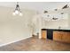 Open kitchen with tile floors and wooden cabinets at 12257 Driftstone Dr, Fishers, IN 46037