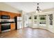 Bright eat-in kitchen with stainless appliances, tile flooring and door to the backyard at 12257 Driftstone Dr, Fishers, IN 46037
