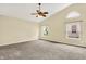 Spacious main bedroom featuring vaulted ceilings, neutral carpet, and large windows at 12257 Driftstone Dr, Fishers, IN 46037