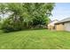 Expansive backyard with lush greenery and ample space for outdoor activities and enjoyment at 12290 Charing Cross Rd, Carmel, IN 46033