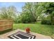 A relaxing backyard with green lush grass and a patio ready for entertaining at 12290 Charing Cross Rd, Carmel, IN 46033