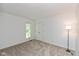 Light-filled bedroom features neutral walls, carpet and a double door closet at 12290 Charing Cross Rd, Carmel, IN 46033