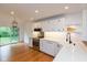 Bright, updated kitchen with white cabinets, quartz countertops, stainless steel appliances, and hardwood floors at 12290 Charing Cross Rd, Carmel, IN 46033